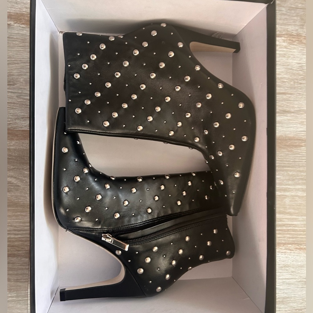 Black studded boots. Brand new on box. Stylish and perfect for fall.